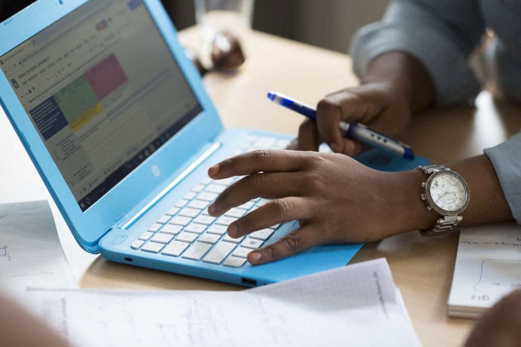 Someone is working on a laptop.